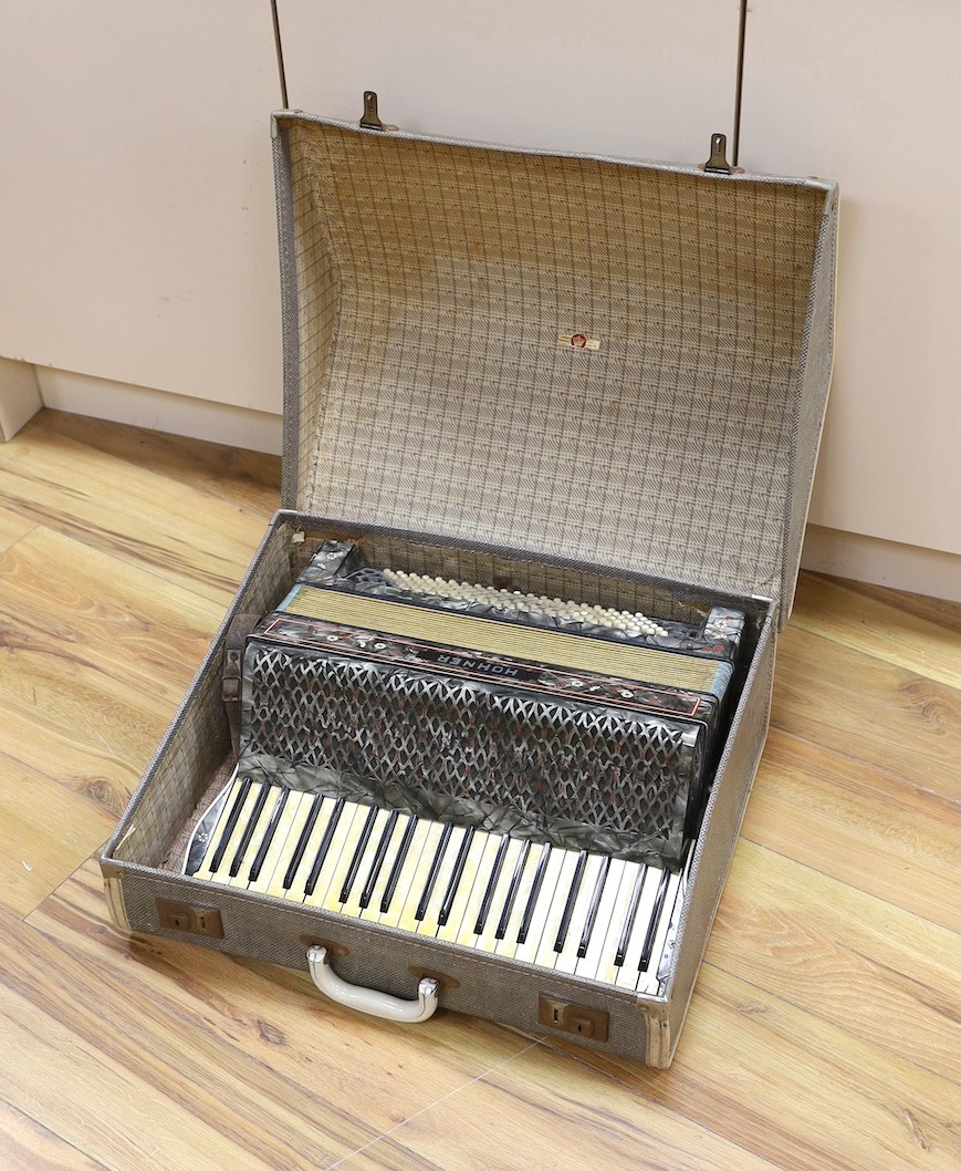 A cased Hohner accordion, Case 57cms wide.